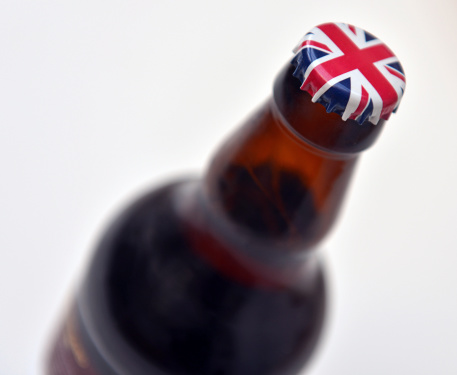 A beer bottle with a British National Flag crown cap 