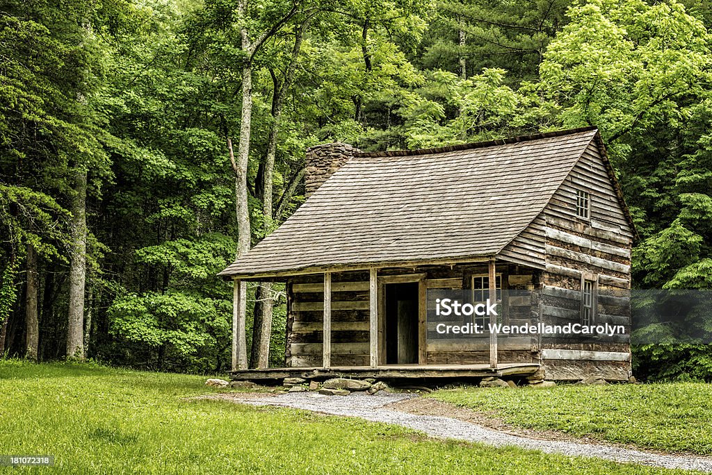 Pioneer Cabin In The Smoky Mountains A century-old settlers' cabin in the Smoky Mountains forest. Log Cabin Stock Photo