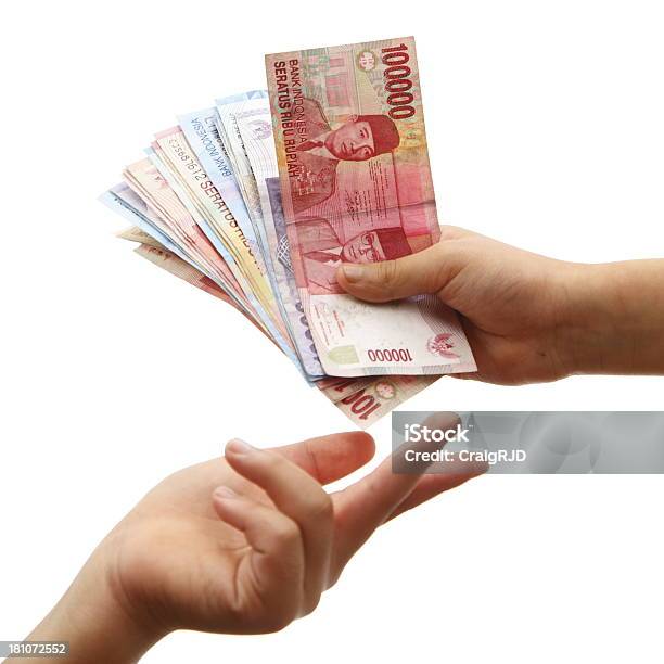 Indonesian Payment Stock Photo - Download Image Now - Indonesian Currency, Currency, Bribing