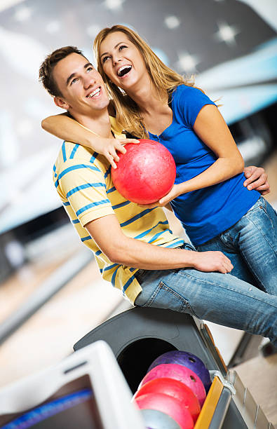 istock Couple embracing at the bowling alley. 181072738