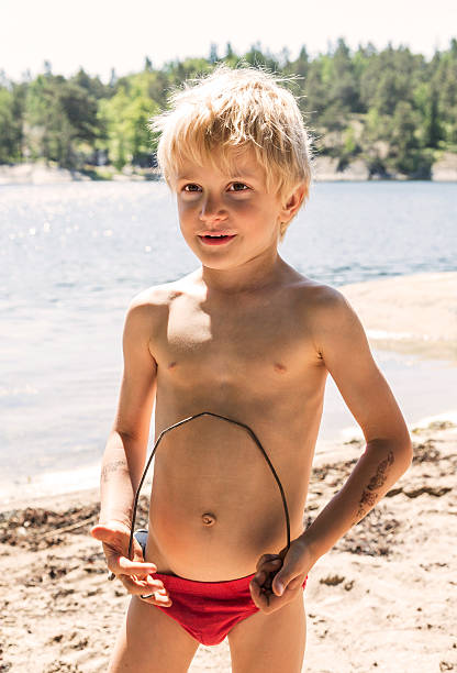 istock Little blond boy playing on the beach in Stockholm Archipelago 181073013