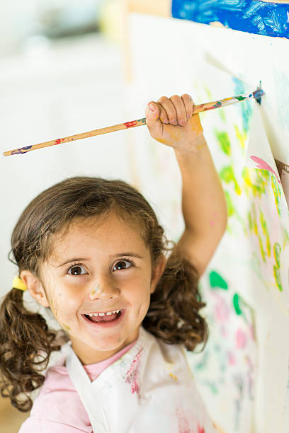 istock Little Girl Painting 181073194