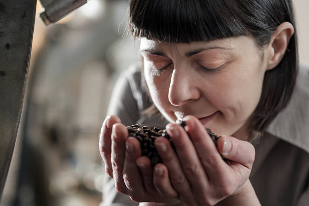 istock Female small business owner smelling fresh roasted coffee 181073647