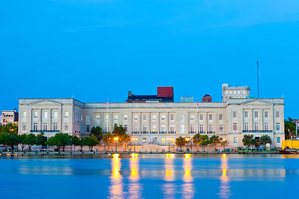 United States District Court In Wilmington, North Carolina "The United States District Court In Wilmington, North Carolina Lit Up At Night On The Cape Fear River." cape fear stock pictures, royalty-free photos & images