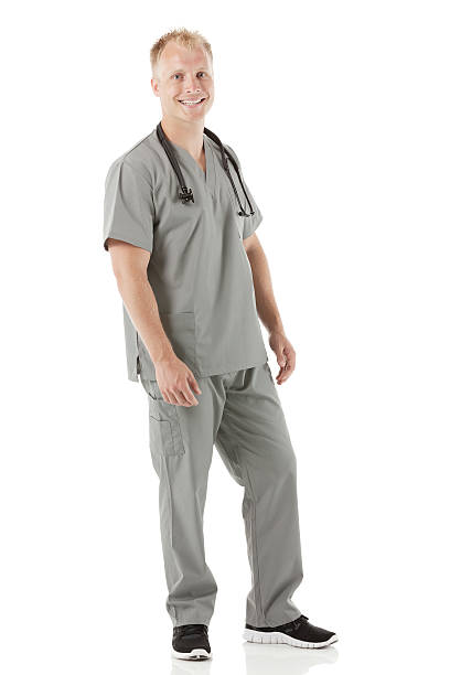 istock Smiling young male nurse against white 181074906