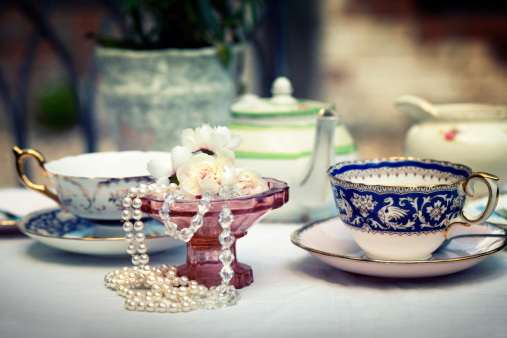 traditional cup porcelin isolated on white background. with Flower Petals and Old Fashioned Porcelin Tea Set