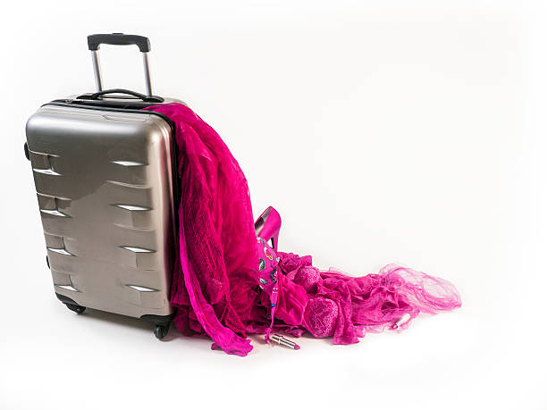 istock Damaged Suitcase Spinner loses its pink female contence 181076294