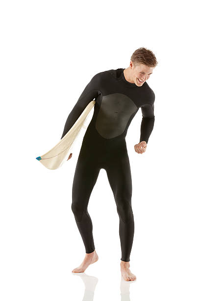 istock Happy male surfer with a surfboard 181076440