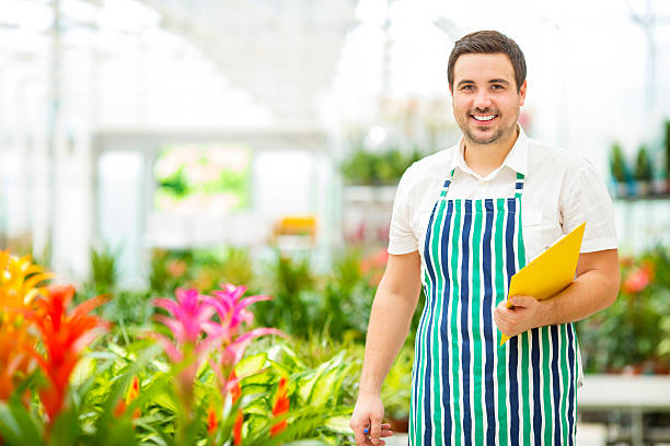 istock Male Florist Working At Garden Center. 181076479