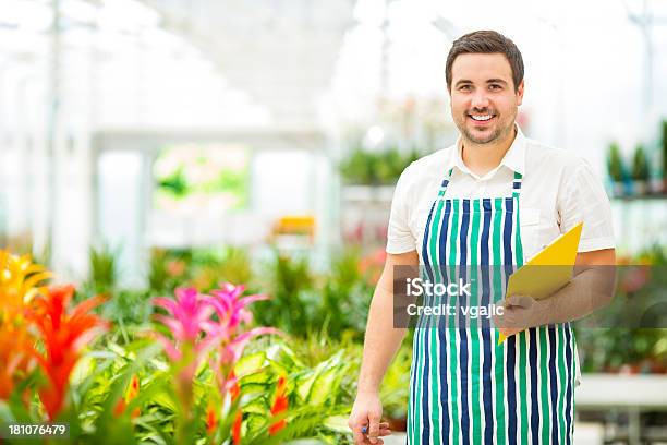 Male Florist Working At Garden Center Stock Photo - Download Image Now - 25-29 Years, Activity, Adult