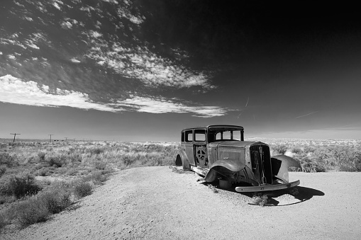 Painted Desert Rusty Model T relic on Route 66  in black and white in Arizona United States