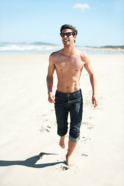 divertimento al sole - men beach running shirtless foto e immagini stock