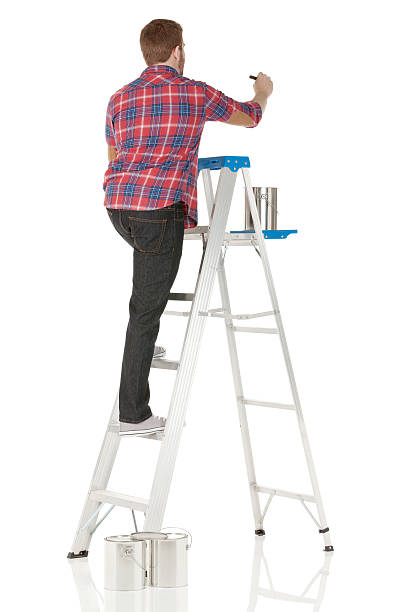 istock Rear view of a male painter painting 181077214