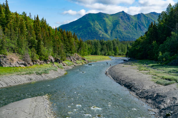 istock fishing in river from mountain valley in Alaska forest valley 1810773358