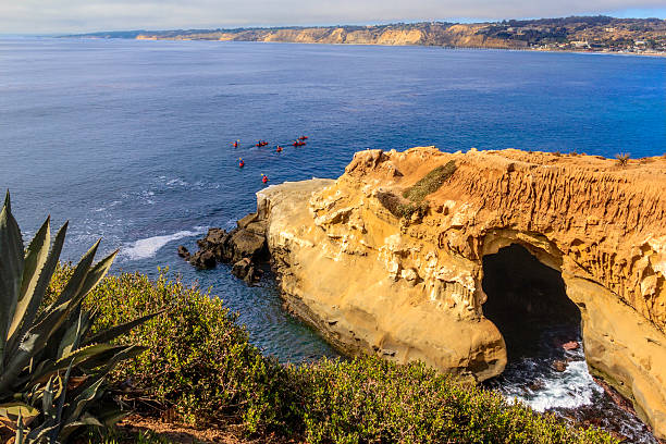La Jolla's Caves and coastline (P) La Jolla Cove's caves show themselves on the eroded cliffs of La Jolla in Southern California, near San Diego la jolla stock pictures, royalty-free photos & images