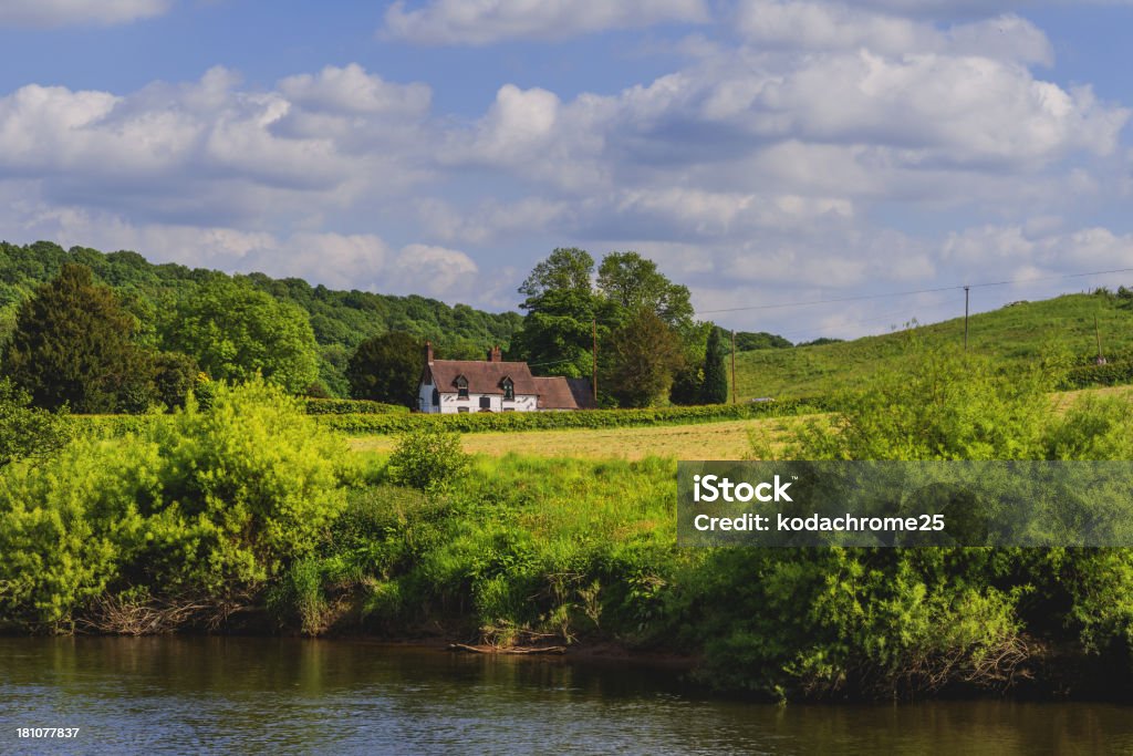 river severn river severn at arley shropshire with sunlight & green vegetation alongside banks - This is the River Severn, Englands longest river on a summers afternoon. The location is Arley Village, Shropshire, the English Midlands, England, UK Cottage Stock Photo