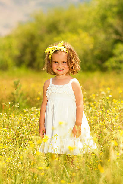 istock Little girl in meadow 181078543
