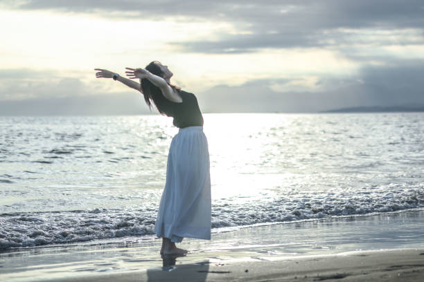 istock Beautiful lady relaxing at beach 1810785767