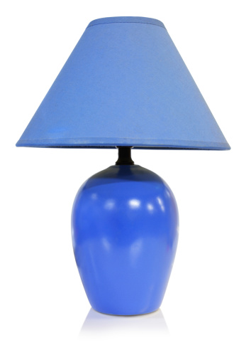 Vintage electrical lamp with  fabric lampshade in blue colors isolated on white.