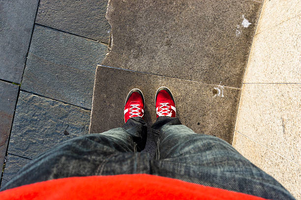 istock Red Sneakers and blue jeans 181079487