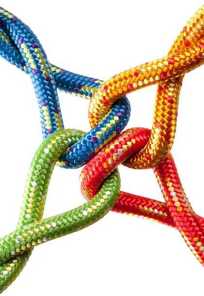 Photo of Concept image. Colored ropes tied into a knot.