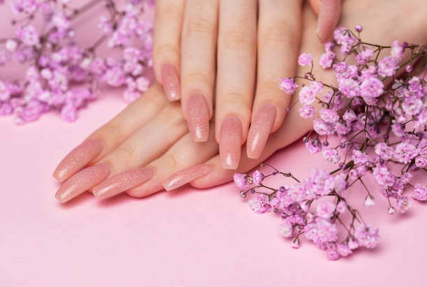 istock Female hands with beautiful manicure on pink background 1810796751