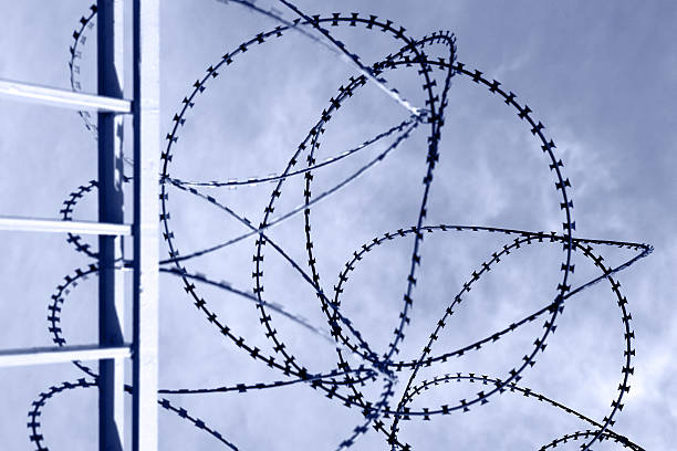 istock barbed wire fence and cloths 181080000