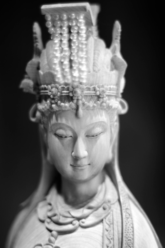 Ancient Statue of Buddhism God - Kwan Yin.