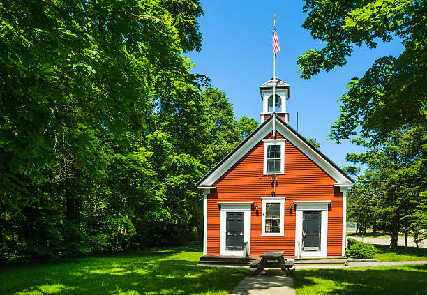 istock One room school house in red and white 181081459