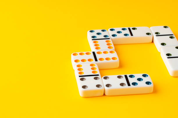 istock Domino tiles on yellow background studio shot 1810819467