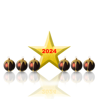 Row of purple Christmas ornaments with 2024 gold star on white background with copy space.