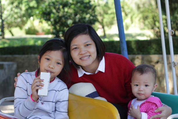 The mother takes her kid to the park and they are very happy