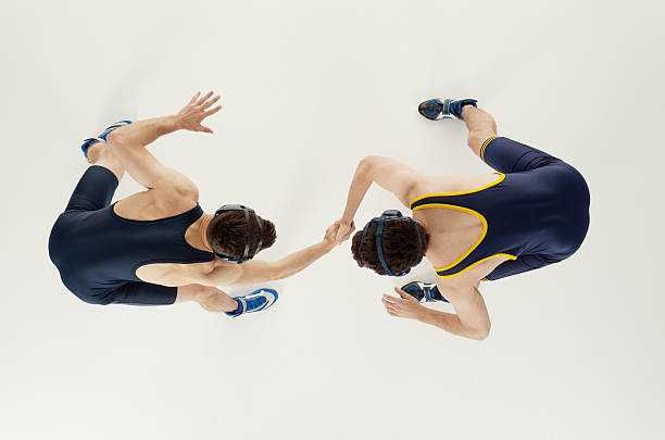 Overhead view of two men wrestling