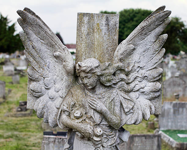 istock Winged angel on cross with roses 181083339