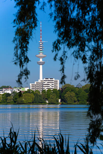 Television tower in Hamburg I LOVE HAMBURG: TV Tower behind the alster lake in Hamburg  - Germany - Taken with Canon 5Dmk3 / EF70-200 f/2.8L IS II USM sendemast stock pictures, royalty-free photos & images
