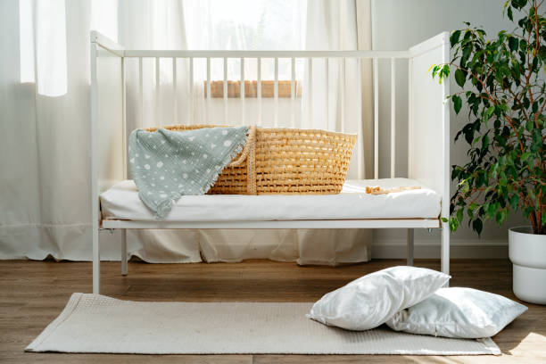 istock Nursery interior and bedding for kids with wicker bassinet 1810848923