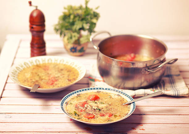 healthy soup with vegetables on a wooden table
