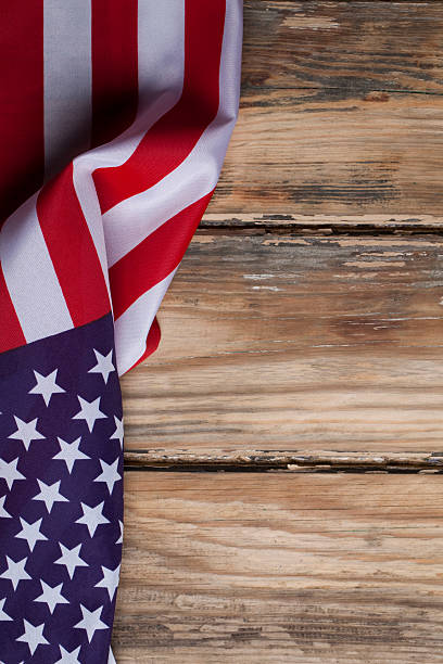 istock American flag on wooden background 181085123