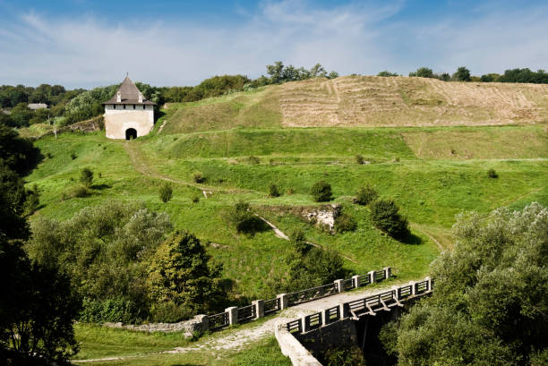Landscape with remains of bastion, bridge, and exterior defending wall ruins of the medieval Romanian fortress Hotin. Today in Ukraine.
