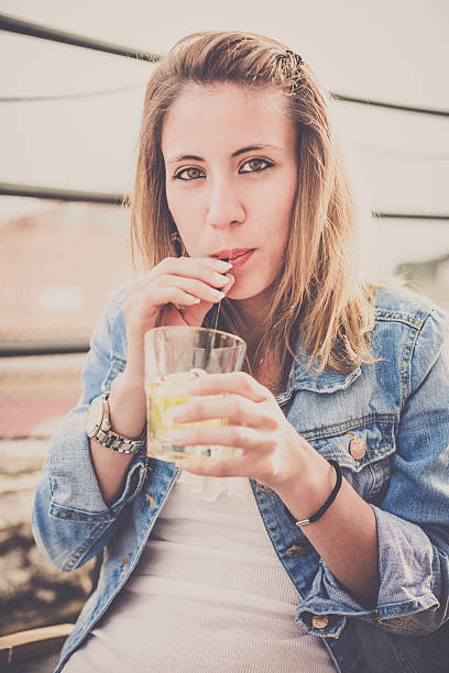 istock Happy Girl drinking a cocktail 181086531
