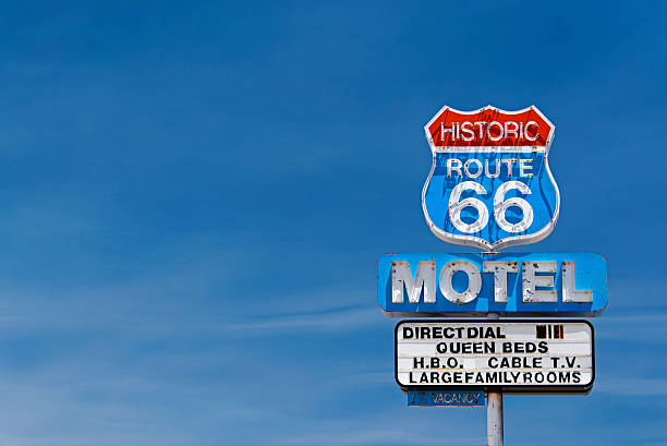 Route 66 Motel Old motel sign along historic route 66 against a blue sky. roadside motel stock pictures, royalty-free photos & images