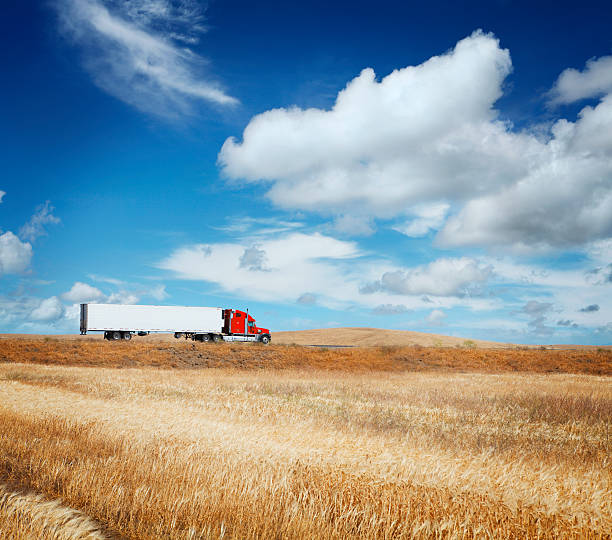 istock American truck going in countryside 181086915