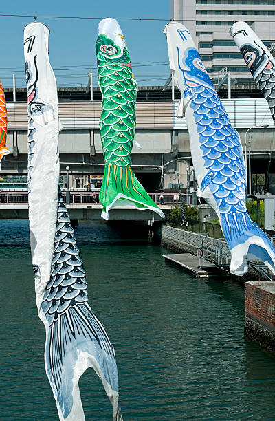 istock Stylized carp kites over river in Japan 181086973