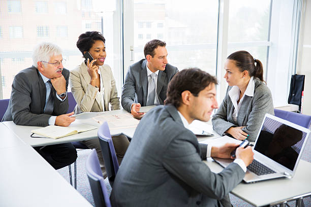 istock Business people in education room talking about their problems 181087346