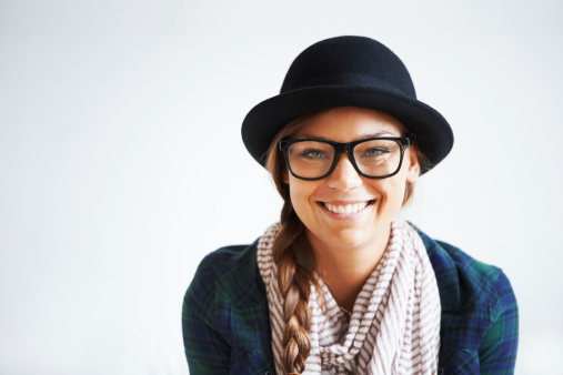 Portrait of a smiling hipster girl with copyspace