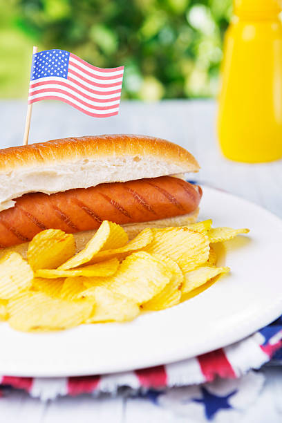 istock Hot dog on an outdoor table in bright light 181087865