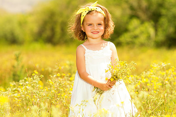 istock Little girl in meadow 181088018