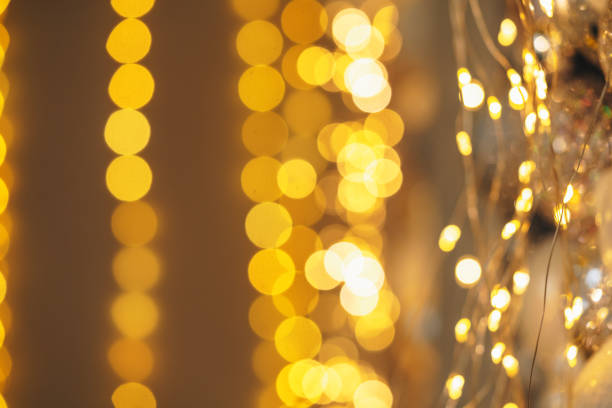 istock Christmas and New Year background with blurred garland lights 1810884449