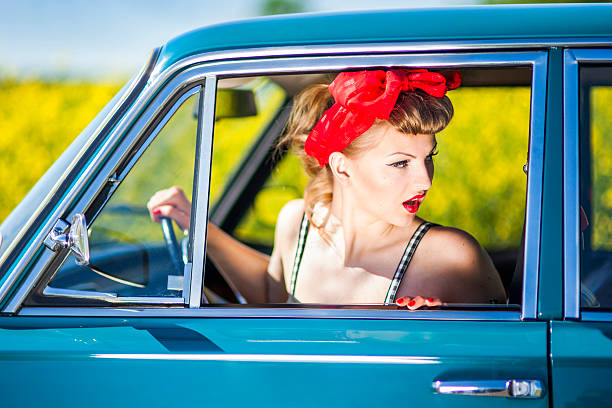 istock Pin-up girl in car 181088570