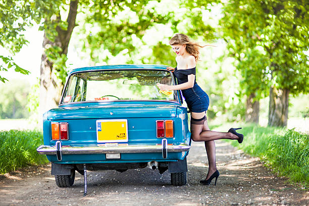istock Pin-up girl with car 181088749